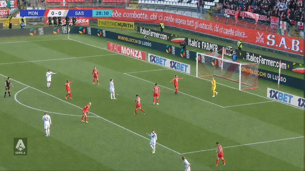 Broadcast frame with backlit advertising boards near goal recovered to full contrast