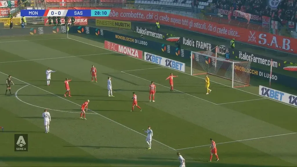 Football stadium in bright sun with glare on the advertising boards
